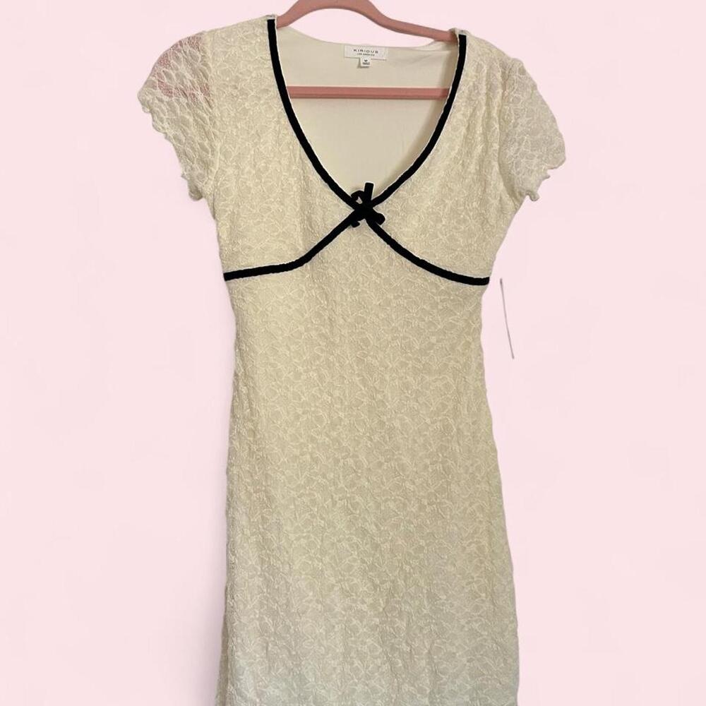 New with tags Kirious white lace mink dress with black velvet trim & bow detail